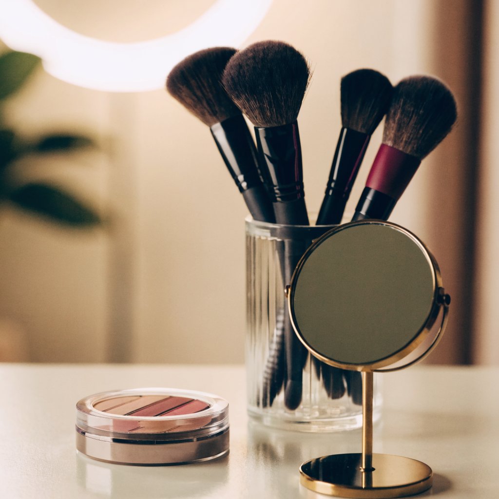 A professional makeup artist's kit laid out in a beautiful home interior