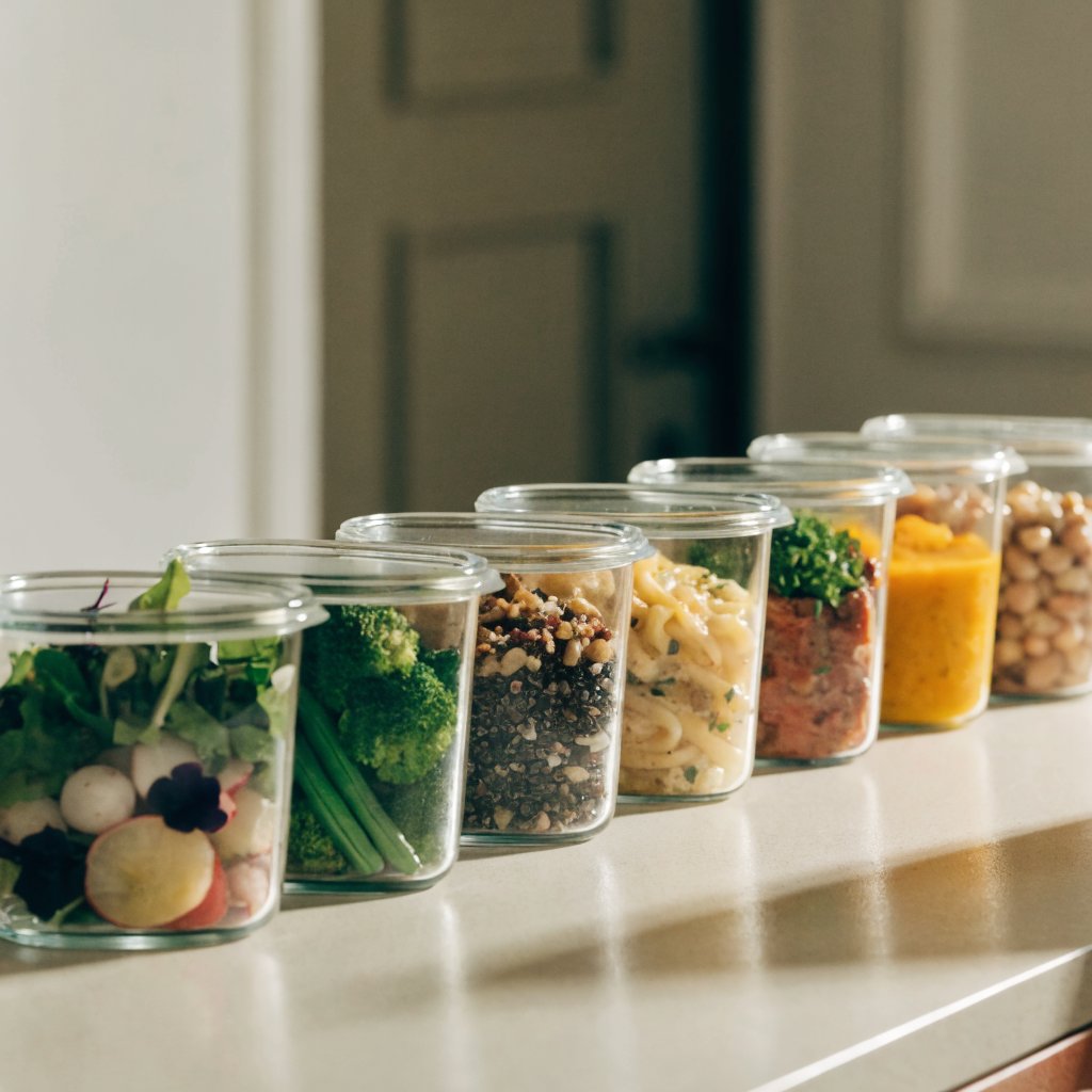 Neatly lined mason jars filled with weekly meal preps